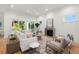 Relaxing living room featuring a comfortable sectional sofa and fireplace at 3011 W Asbury Pl, Tampa, FL 33611