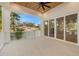 Spacious covered patio with glass doors and pool access at 3011 W Asbury Pl, Tampa, FL 33611
