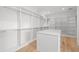Large walk-in closet with ample shelving and hanging space at 3011 W Asbury Pl, Tampa, FL 33611