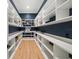 Spacious walk-in pantry with ample shelving for storage at 3011 W Asbury Pl, Tampa, FL 33611