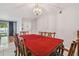 Cozy dining area featuring traditional wood furniture and modern lighting at 3114 Lake Pine Way # H2, Tarpon Springs, FL 34688
