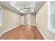 Bright bedroom featuring hardwood floors and an ensuite bathroom at 5034 Elm Leaf Dr, Brooksville, FL 34601
