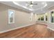 Spacious bedroom with hardwood floors and large windows at 5034 Elm Leaf Dr, Brooksville, FL 34601