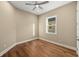 Simple bedroom with hardwood floors and a window at 5034 Elm Leaf Dr, Brooksville, FL 34601