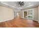 Hardwood floor bedroom with access to backyard through sliding doors at 5034 Elm Leaf Dr, Brooksville, FL 34601