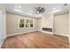Spacious bedroom with hardwood floors and a fireplace at 5034 Elm Leaf Dr, Brooksville, FL 34601