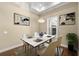 Elegant dining room with hardwood floors and chandelier at 5034 Elm Leaf Dr, Brooksville, FL 34601