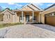 Front elevation showcasing a stone and shingle home at 5034 Elm Leaf Dr, Brooksville, FL 34601