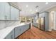 Spacious kitchen with light blue cabinets, stainless steel appliances, and white marble countertops at 5034 Elm Leaf Dr, Brooksville, FL 34601
