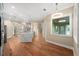 Bright and airy kitchen nook area with hardwood floors and a view to the kitchen at 5034 Elm Leaf Dr, Brooksville, FL 34601