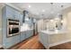 Eat-in kitchen with stainless steel appliances and a large island with marble countertop at 5034 Elm Leaf Dr, Brooksville, FL 34601