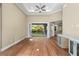 Open living space with hardwood floors and backyard access at 5034 Elm Leaf Dr, Brooksville, FL 34601