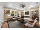 Living room with fireplace, hardwood floors, and built-in shelving at 5034 Elm Leaf Dr, Brooksville, FL 34601