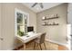 Home office with built-in shelving and window views at 5034 Elm Leaf Dr, Brooksville, FL 34601