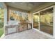 Outdoor kitchen with built-in grill, sink, and refrigerator at 5034 Elm Leaf Dr, Brooksville, FL 34601