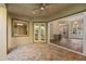 Covered patio with brick flooring and view to interior at 5034 Elm Leaf Dr, Brooksville, FL 34601