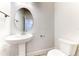 Small half bathroom with pedestal sink and toilet at 16134 69Th Lane East, Parrish, FL 34219