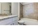 Clean bathroom with granite countertop, white vanity, and bathtub at 16134 69Th Lane East, Parrish, FL 34219