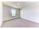 Cozy bedroom featuring neutral wall paint, carpeting and a window at 16134 69Th Lane East, Parrish, FL 34219