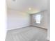Simple bedroom with neutral walls, carpeting and a window with lake view at 16134 69Th Lane East, Parrish, FL 34219