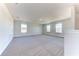Spacious bonus room with neutral carpeting and multiple windows at 16134 69Th Lane East, Parrish, FL 34219