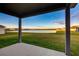 Spacious covered patio overlooking a serene lake at 16134 69Th Lane East, Parrish, FL 34219