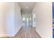 Bright and airy hallway with wood-look tile floor at 16134 69Th Lane East, Parrish, FL 34219