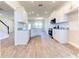 Open kitchen with white cabinets, granite counters and stainless steel appliances at 16134 69Th Lane East, Parrish, FL 34219