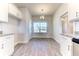 Bright kitchen nook with window and wood-look tile floor at 16134 69Th Lane East, Parrish, FL 34219