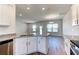Modern kitchen island with granite countertops and white cabinets at 16134 69Th Lane East, Parrish, FL 34219
