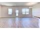 Bright and spacious living room with wood-look flooring and access to the backyard at 16134 69Th Lane East, Parrish, FL 34219