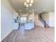Open living area with kitchen, stairs, and wood-look floors at 16134 69Th Lane East, Parrish, FL 34219