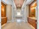 Primary bathroom with double vanities, a large soaking tub, and columns at 19451 Ganton Ave, Bradenton, FL 34202