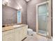 Guest bathroom with a granite vanity and a shower at 19451 Ganton Ave, Bradenton, FL 34202