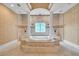 Luxurious Primary bathroom with soaking tub, walk-in shower, and and sinks at 19451 Ganton Ave, Bradenton, FL 34202