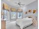 Bright bedroom with a ceiling fan and views of the backyard at 19451 Ganton Ave, Bradenton, FL 34202