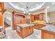 Gourmet kitchen features custom cabinetry, granite countertops, and a large island at 19451 Ganton Ave, Bradenton, FL 34202