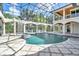 Screened-in pool area featuring a water feature, spa, and views of the surrounding landscape at 19451 Ganton Ave, Bradenton, FL 34202