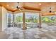 Spacious screened porch with checkered floor and pool view at 19451 Ganton Ave, Bradenton, FL 34202
