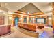 Home theater with curved seating and large projection screen at 19451 Ganton Ave, Bradenton, FL 34202
