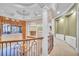 Upper hallway with a beautiful chandelier and views to the lower level at 19451 Ganton Ave, Bradenton, FL 34202