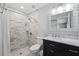 Bathroom with marble vanity and walk-in shower at 1247 Holiday Dr, Tarpon Springs, FL 34689