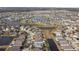 Aerial view of a neighborhood with houses and water features at 6843 Boulder Run Loop, Wesley Chapel, FL 33545