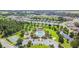 Aerial view of community with pool, playground, and basketball court at 6843 Boulder Run Loop, Wesley Chapel, FL 33545
