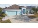 House with two-car garage, and landscaped yard at 6843 Boulder Run Loop, Wesley Chapel, FL 33545