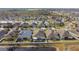 Aerial view of houses and a lake in a residential area at 6843 Boulder Run Loop, Wesley Chapel, FL 33545