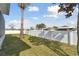 Landscaped backyard with grassy area and privacy fence at 6843 Boulder Run Loop, Wesley Chapel, FL 33545