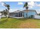 Home exterior view with fenced backyard and screened patio at 6843 Boulder Run Loop, Wesley Chapel, FL 33545