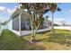 Spacious backyard with screened patio and landscaping at 6843 Boulder Run Loop, Wesley Chapel, FL 33545