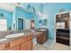 Double vanity bathroom with light blue walls and gray countertops at 6843 Boulder Run Loop, Wesley Chapel, FL 33545